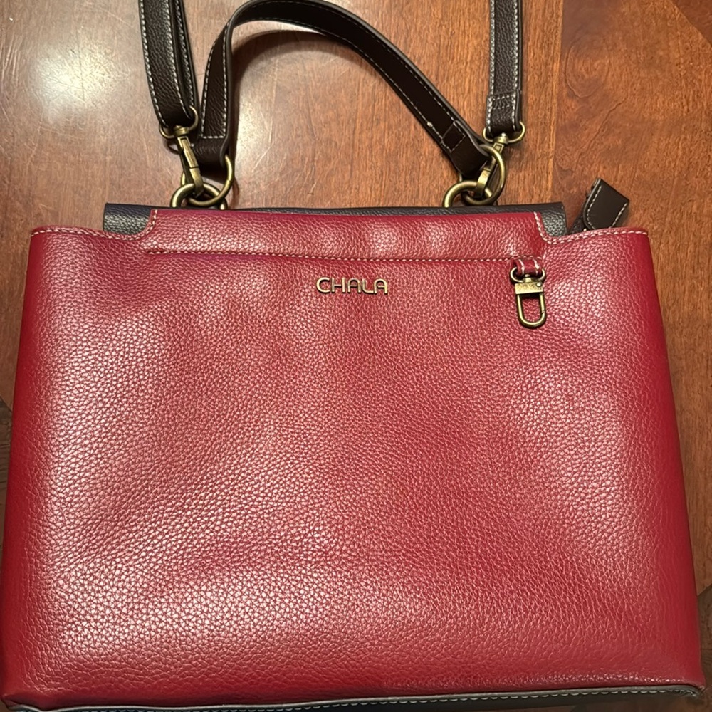 CHALA purse, red with brown trim. Good condition.